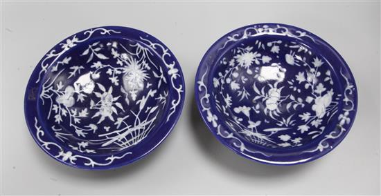 A pair of Chinese slip-decorated blue ground stem bowls, diameter 23cm